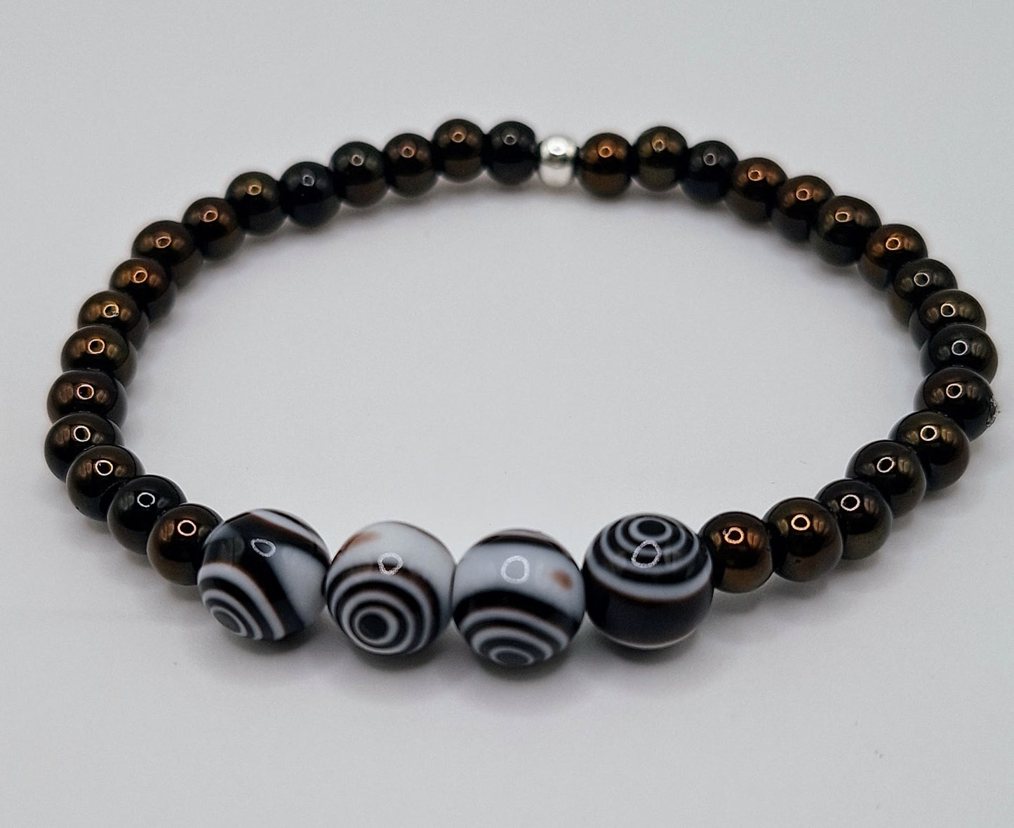 Introducing our stylish and versatile Men's Black Obsidian and Black White Eye Glass Lamp work Beaded Stretchy Bracelet!