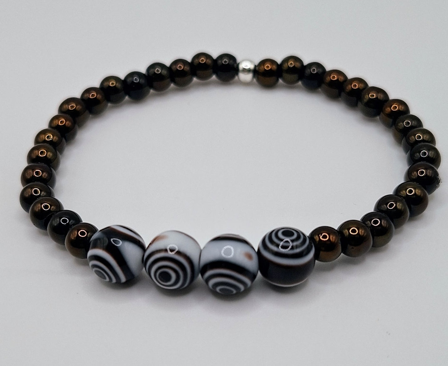 Introducing our stylish and versatile Men's Black Obsidian and  Black White Eye Glass Lamp work Beaded Stretchy Bracelet!